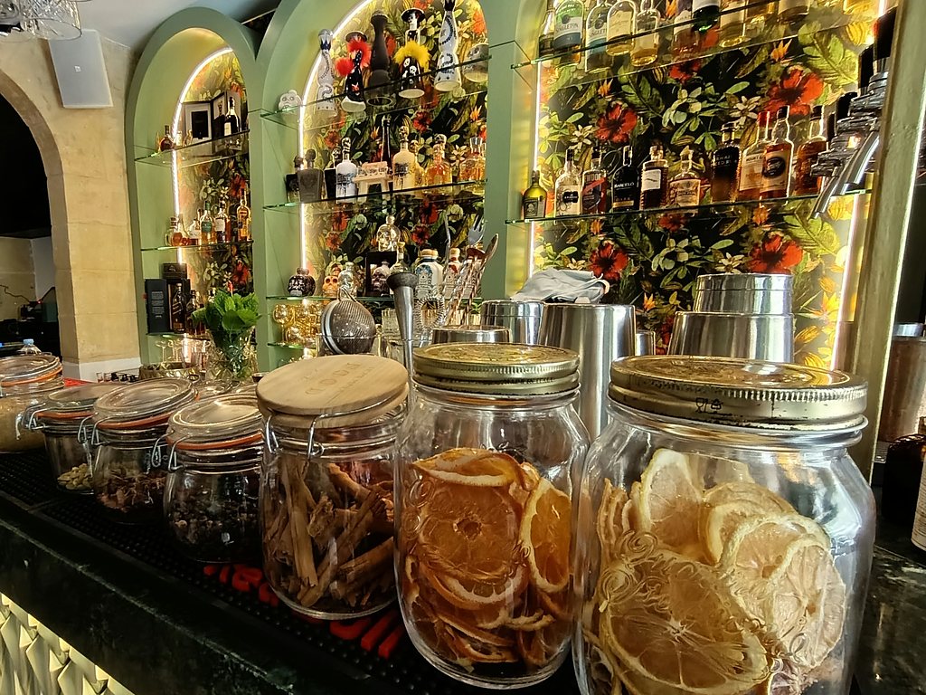 Delicatessen counter with preserve jars set into arched niches